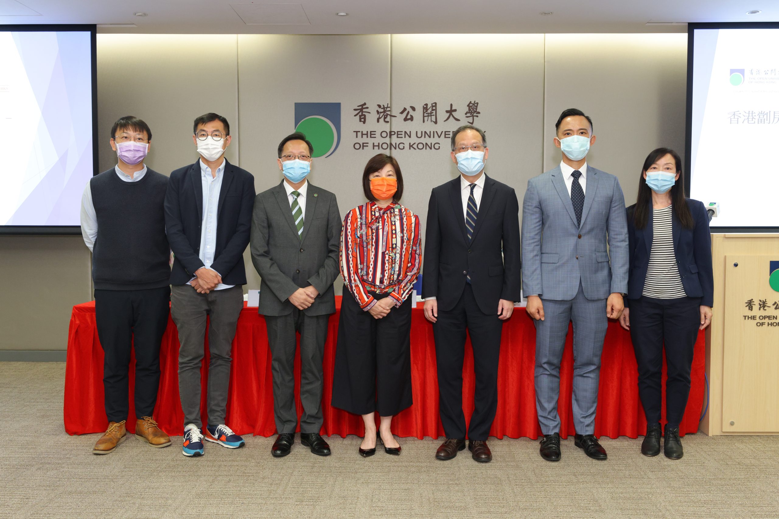 The Open University of Hong Kong President Prof. Paul Lam Kwan-sing (third from right), the Chief Executive of the Hong Kong Lutheran Social Service, LC-HKS, Dr Annissa Lui Wai-ling (fourth from left) take a photo with the research team.